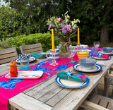 lobster table runner with plates laid settings outdoors